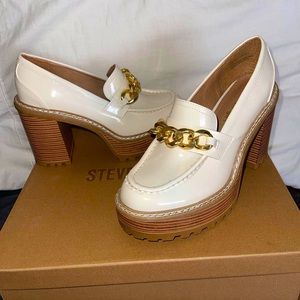 These are Steve Madden loafers in white, cream and tan colour